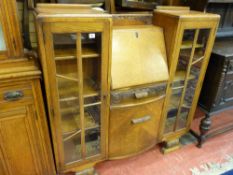 A CIRCA 1930's OAK SIDE BY SIDE BUREAU CABINET, 124 cms high, 121 cms wide, 31 cms deep