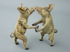 A COLD BRONZE BERGMAN GROUP of pair of dancing pigs