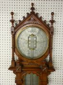 AN ADMIRAL FITZROY ROYAL POLYTECHNIC BAROMETER by Joseph Davies & Co in a golden oak Gothic style