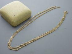 AN EIGHTEEN CARAT GOLD CURB LINK DOUBLE CHAIN with ring bolt clasp, 51 cms each strand, 43.5 grms