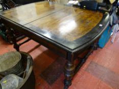 Oblong walnut multi-use table with wide ebonized border and turned supports and stretchers