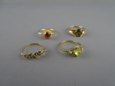 Four nine carat gold dress rings with precious stones, 6.5 grms