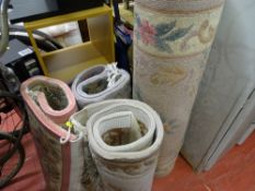 Three small and one larger washed Chinese rugs