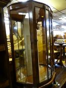 Walnut bow front china cabinet