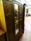 Polished double wardrobe with centre mirrored door and base drawer