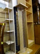 Three CD racks and an open light wood effect multi-use bookcase