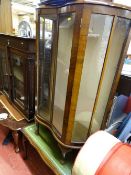 Walnut china cabinet with inward curved door and a Long John coffee table