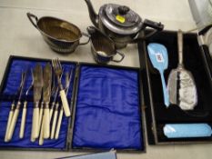 Cased enamel backed dressing table set, a three piece electroplate tea service and a cased set of