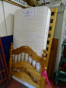 Sealy Posturepedic single bed with wooden base and pine headboards