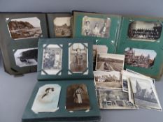 Collection of four hundred plus vintage postcards and photographs contained in three albums and