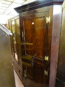 Early Victorian mahogany standing corner cupboard with panelled doors