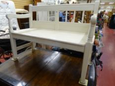 White painted classically shaped garden bench