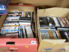 Two boxes containing very large quantity of mixed DVDs (approx 100)