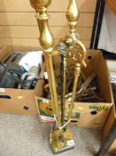 Brass fire irons on a stand