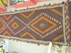 Meshwani carpet runner on a blue and red ground with central repeating diamond pattern and double