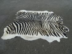 Good large zebra? skin rug