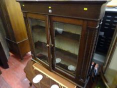 Two glazed door polished top of a bureau bookcase and a modern Italian style low coffee table