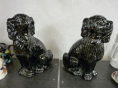 Pair of black Staffs dogs