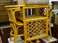 Bamboo and canework tete-a-tete table and two chairs and a pink Lloyd loom glass topped linen
