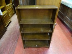 Four shelf open polished bookcase