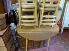 Brown oval formica drop leaf kitchen table and four chairs, a two door cabinet cupboard on castors