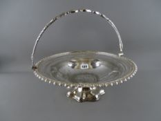 Electroplate swing handled pedestal basket