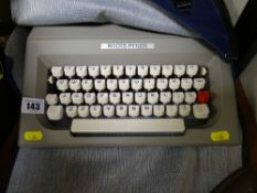 Cased Boots PT1000 typewriter and an old smoothing iron