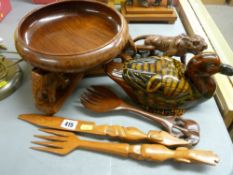 Circular bowl on elephant stand, a carved tiger, a pottery duck and cover etc