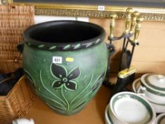 Large green pottery planter and a brass and iron set of fire irons on stand