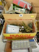 Quantity of Hornby, Corgi and tinplate layout buildings and accessories