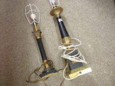 Two classically styled gilt and black decorative table lamps