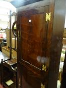 Early Victorian mahogany standing corner cupboard with panelled doors