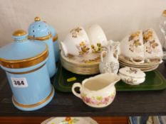 Blue and gilt Portmeirion storage jar and cover, two similar pots, a quantity of floral decorated