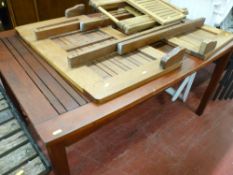 Teak extending garden table along with one other folding table