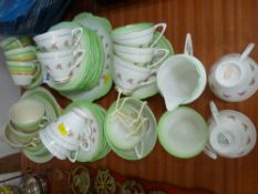 Green and rose decorated part teaset with others