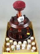 Collection of fifteen Royal Crown Derby bone china thimbles on a pin cushion top wooden stand