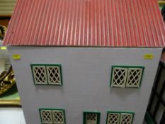 Red roofed doll's house with miscellaneous contents