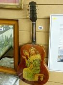 Small vintage guitar with gypsy girl decoration to the reverse