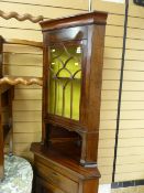 Standing corner cupboard with glazed top door
