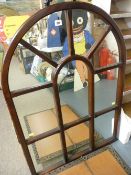 Multi-sectional arched top mahogany framed wall mirror