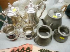 Four piece EP teaset and a three piece beaten pewter teaset