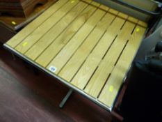 Small modern garden table with wooden slats and chrome base