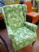 Wingback armchair with leaf upholstery