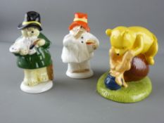 Two Coalport china Paddington Bear figurines and a Royal Doulton Winnie the Pooh 'Isn't It Funny How