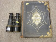 Welsh family Bible with gilt metal clasps and mounts and a pair of vintage field binoculars