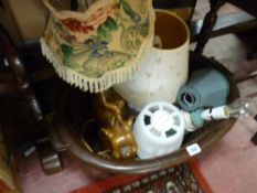 Basket containing assortment of table lamps