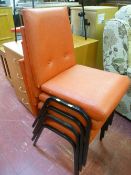 Parcel of four red metal framed stacking chairs