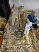 Two embroidered wall hangings and a small blue tassel ended rug