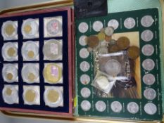 Twelve coin set of limited edition commemorative coins with pre-decimalization coin inlays and