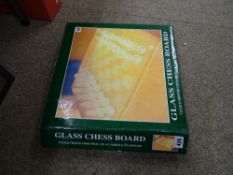Boxed glass chess board with clear and frosted chess pieces